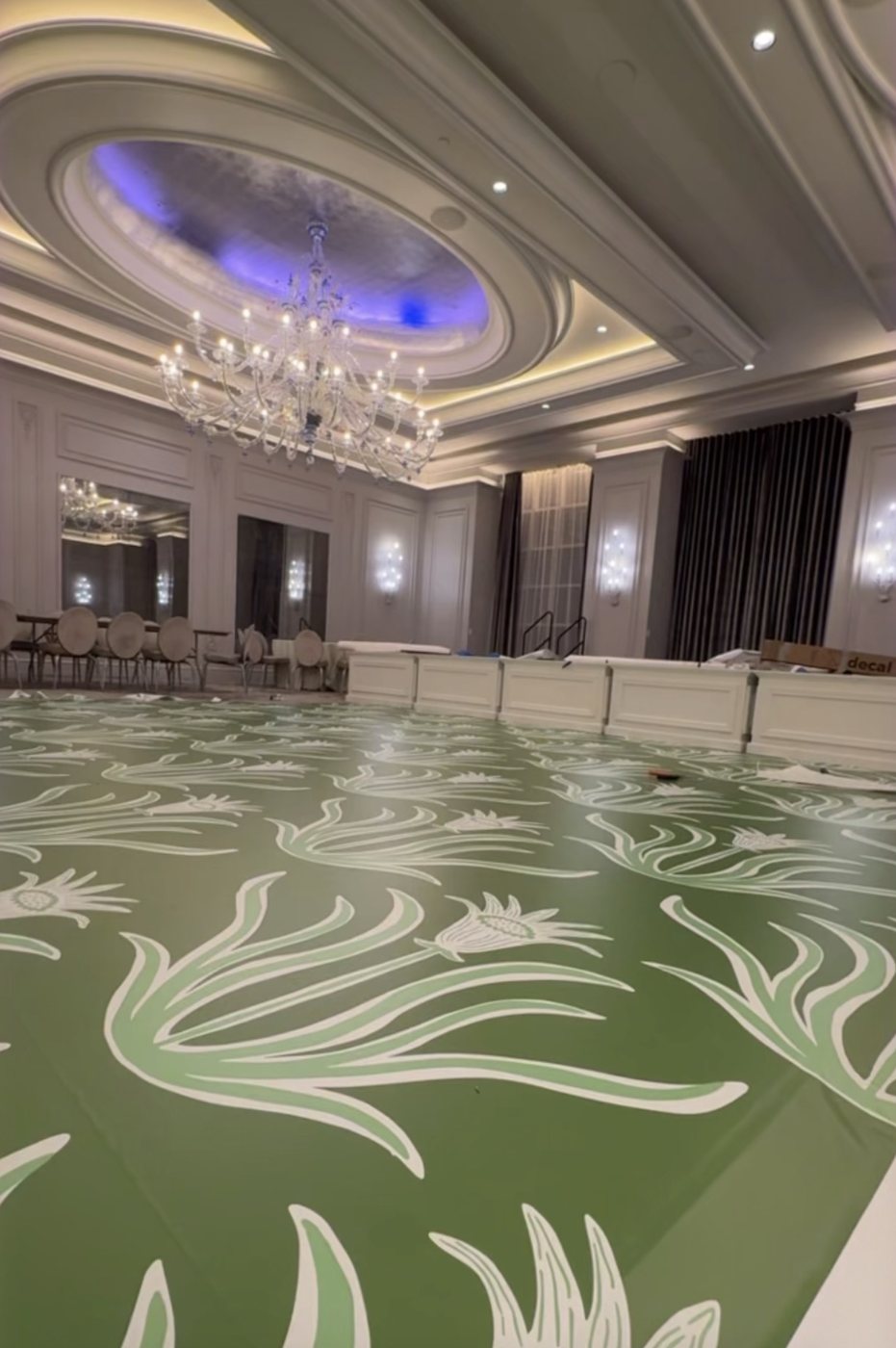 Emerald green dance floor wrap with a white and sage botanical print at The Grand Bohemian Hotel Charlotte