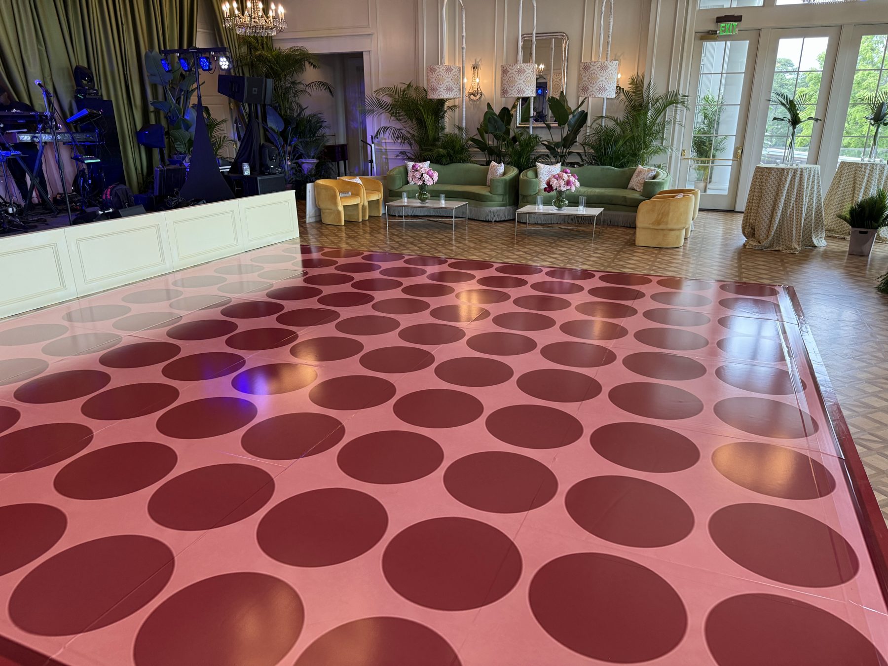 Pink dance floor wrap with burgundy polka dots at Myers Park Country Club